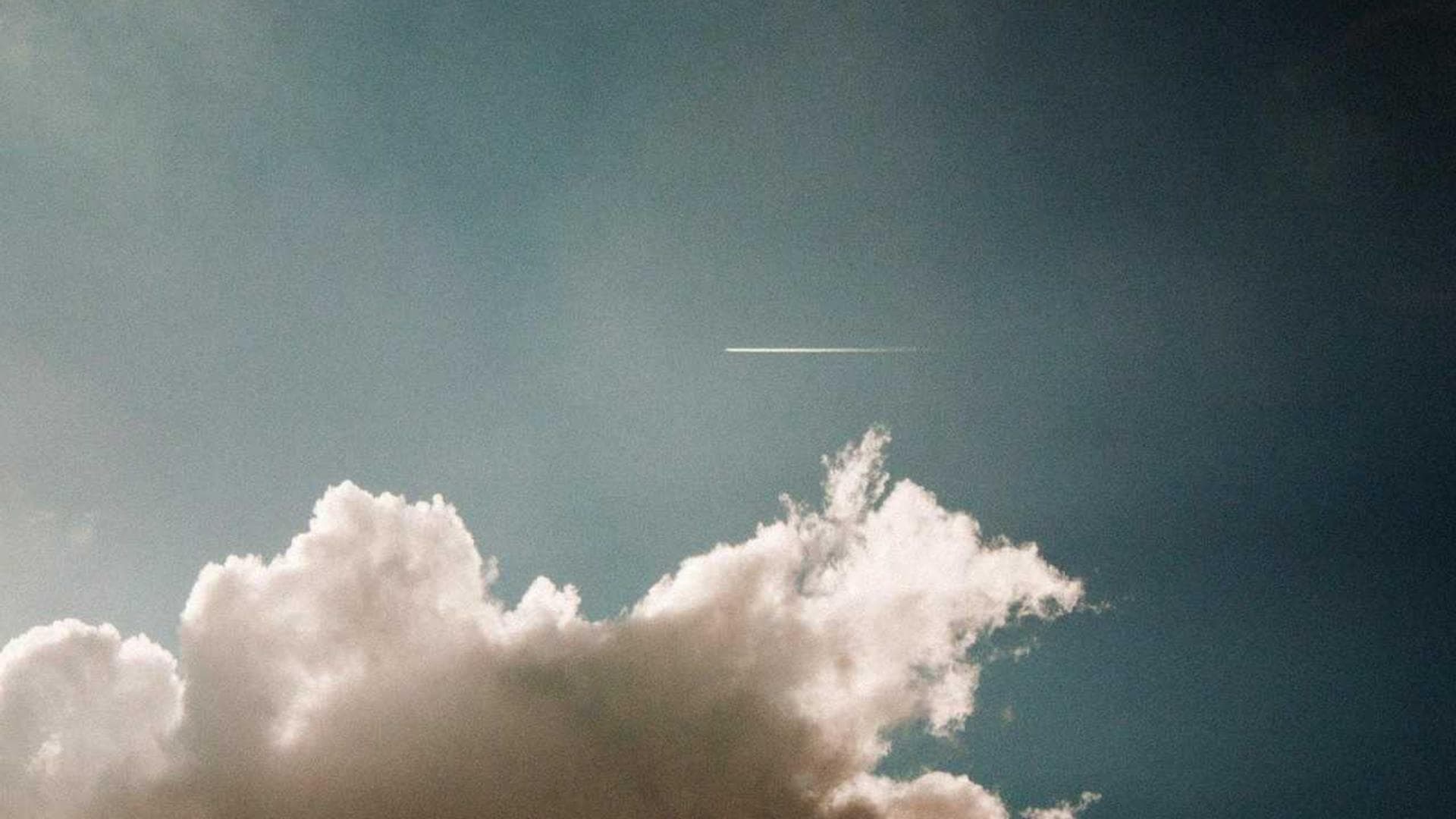 A bright and modern school campus with students walking